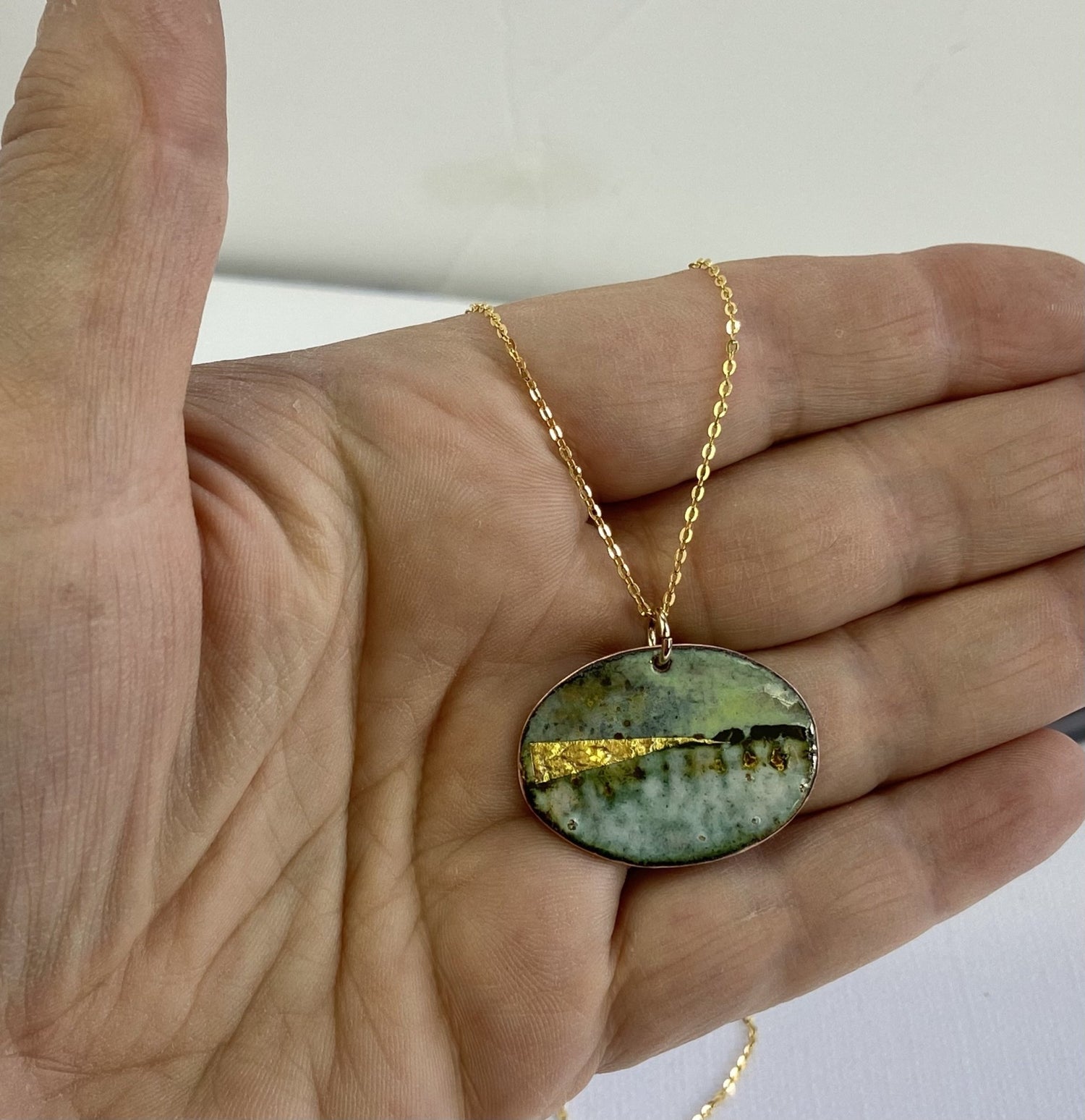 Oval pendant necklace gold sales